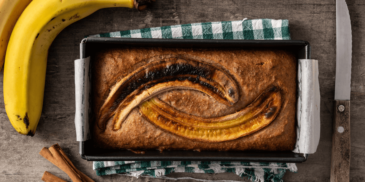 Best Vegan banana bread recipe. Picture with bananas the finished bread, and other aesthetics.