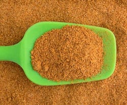 Cajun Seasoning recipe ready to eat spice mix with green portion scoop.