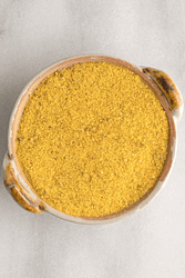 powdered chicken bouillon or vegan chicken stock powder in a decorative bowl on a countertop.