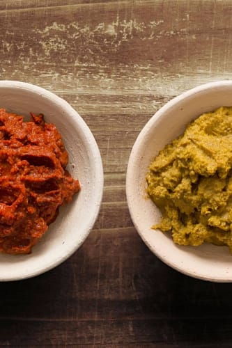 Yellow curry Paste next to another curry paste. 