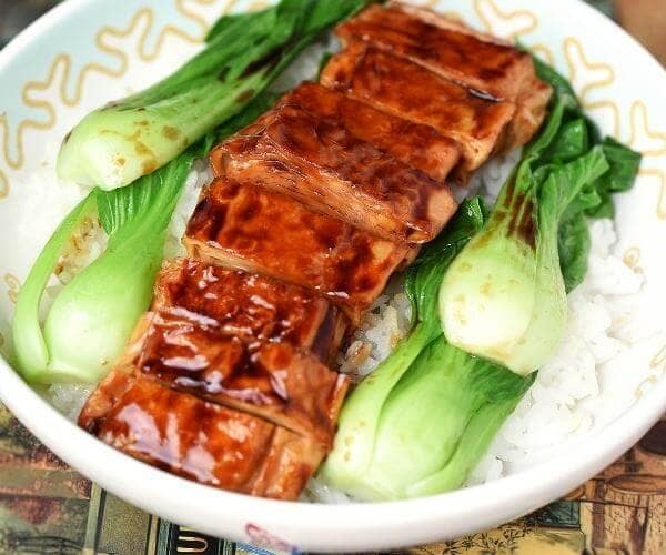 Vegan BBQ Ribs with local greens on a bed of white rice