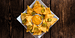 vegan nacho cheese, vegan nacho cheese recipe, vegan nacho cheese sauce, dairy free nacho cheese featured image of a plate of vegan nachos with pickled jalapenos.