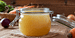 Vegan Chicken broth recipe or vegan chicken stock in a closed jar with recipe ingredients in the background.